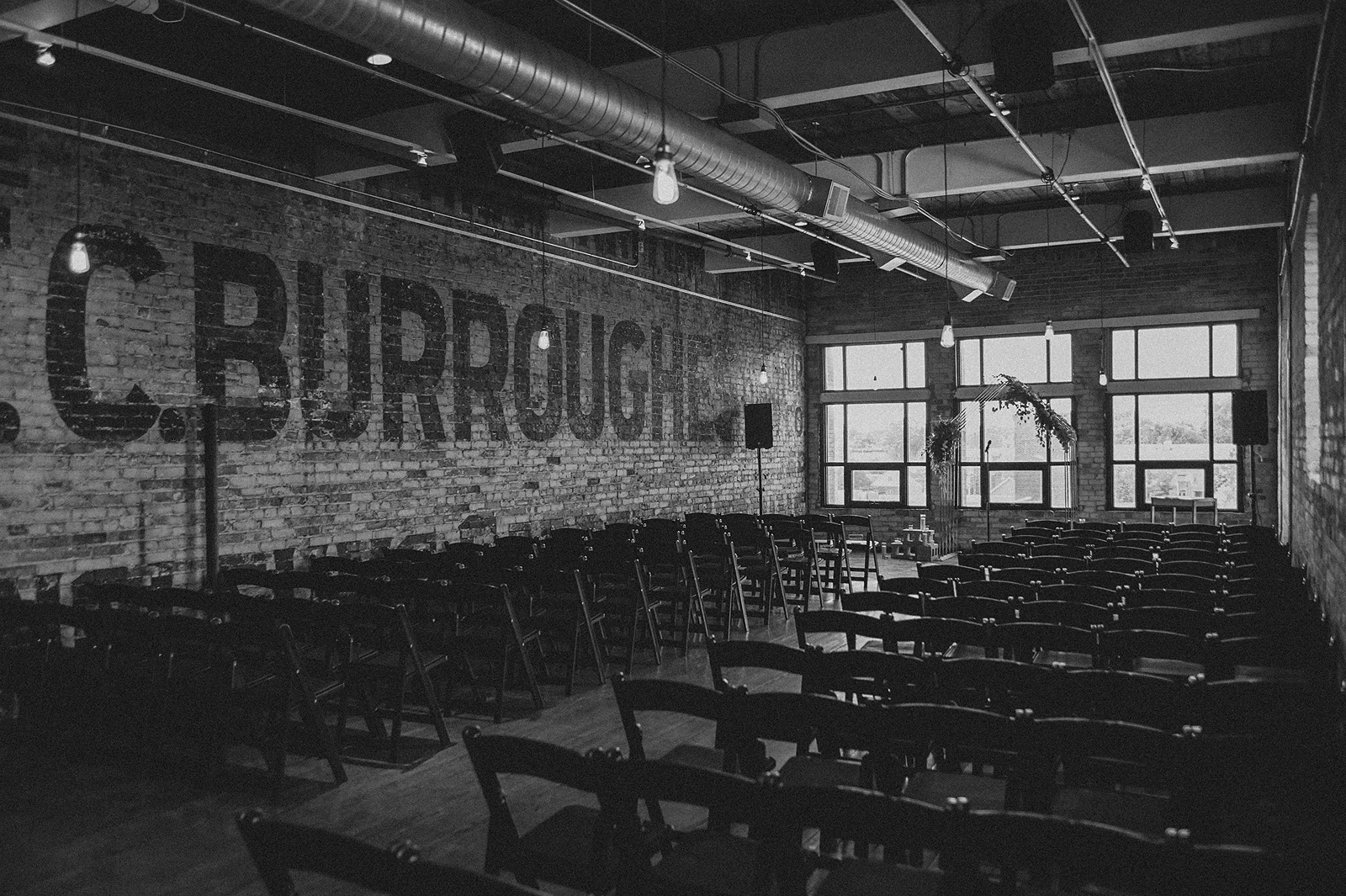 an intertior view of chairs arranged before a ceremony at the Burroughes Building