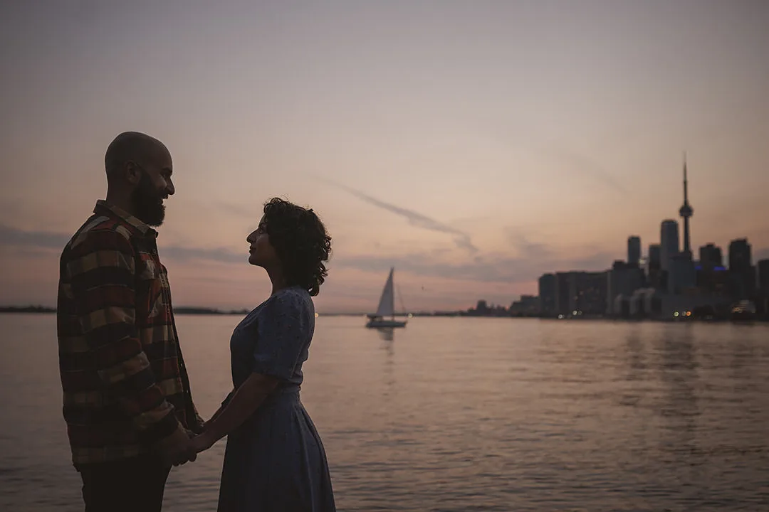 engaged couple silhouetted against the Toronto skyline