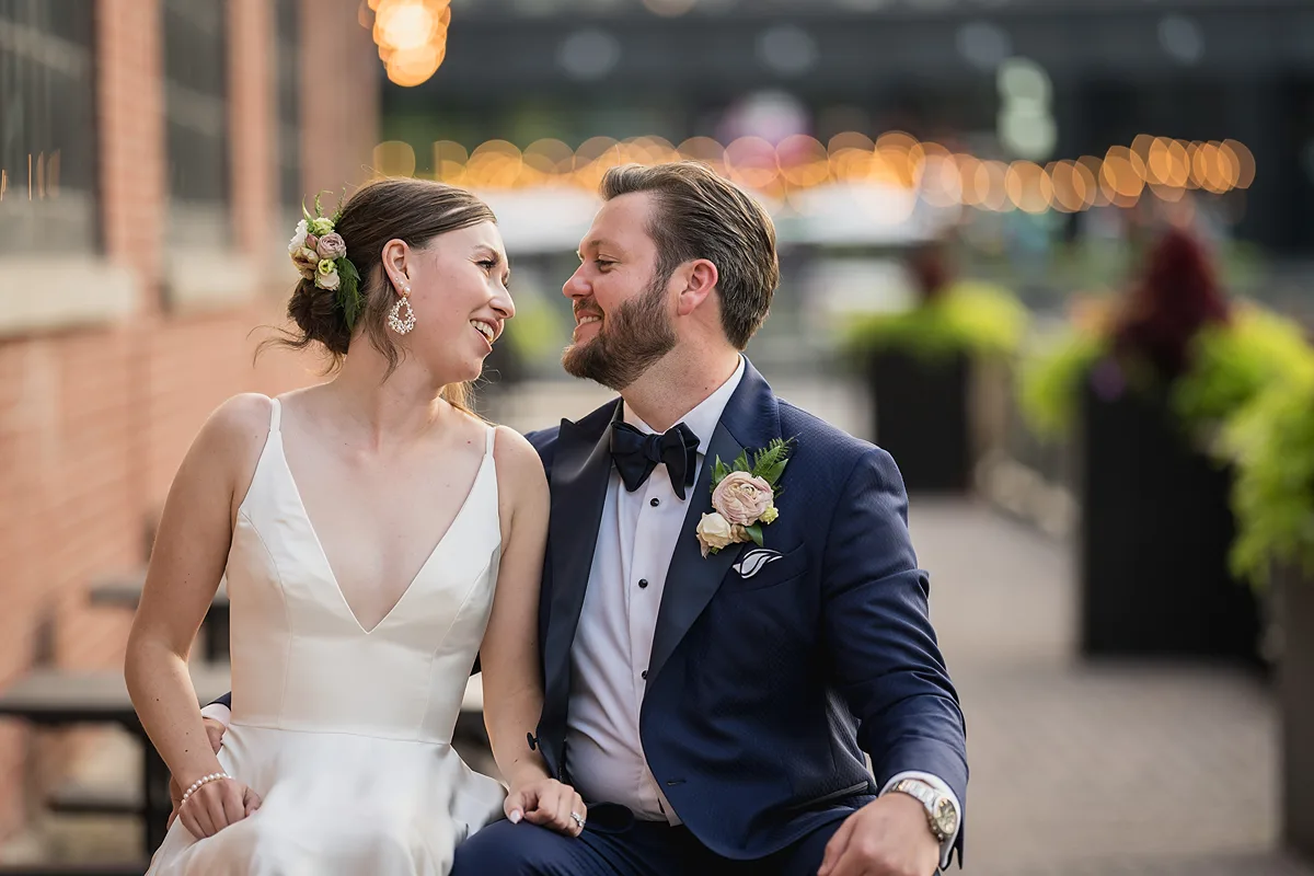 Documentary-style photo of a bride and groom at Steam Whistle