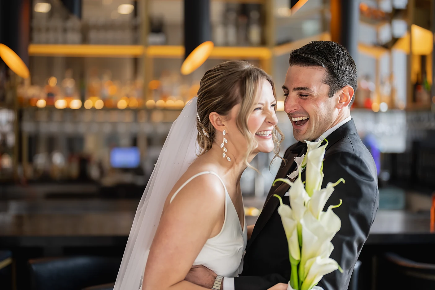 the bride and groom laugh inside Ricarda's