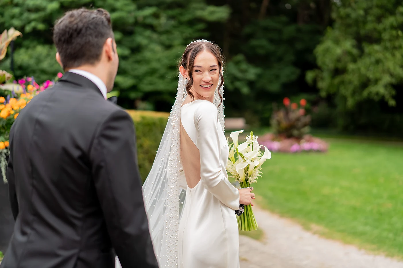 Bride smiles back at her groom