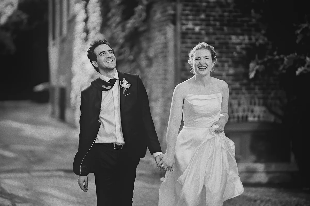 A joyful walking portrait of the happy couple