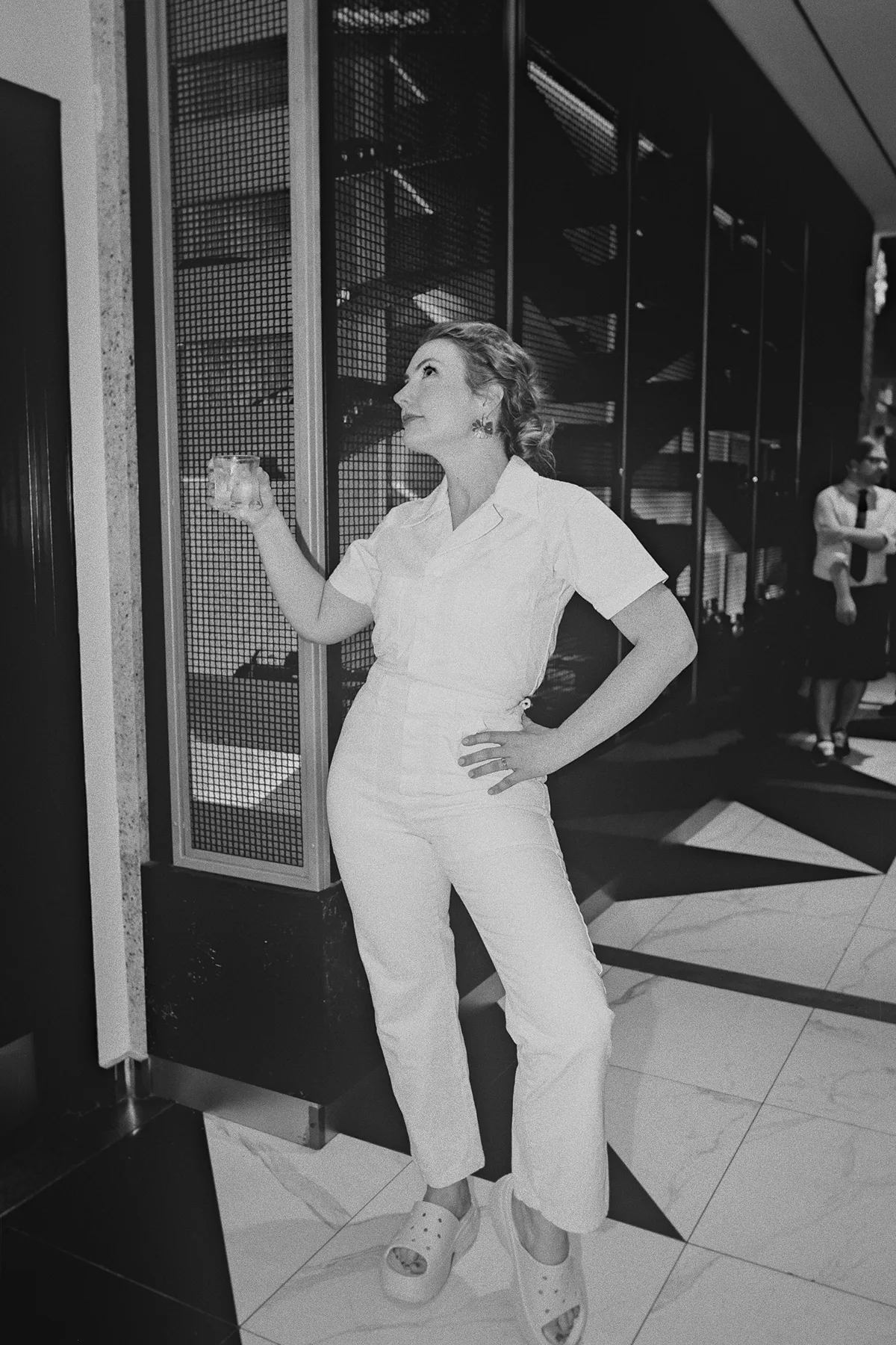 Beth poses in her stylish white reception jumpsuit