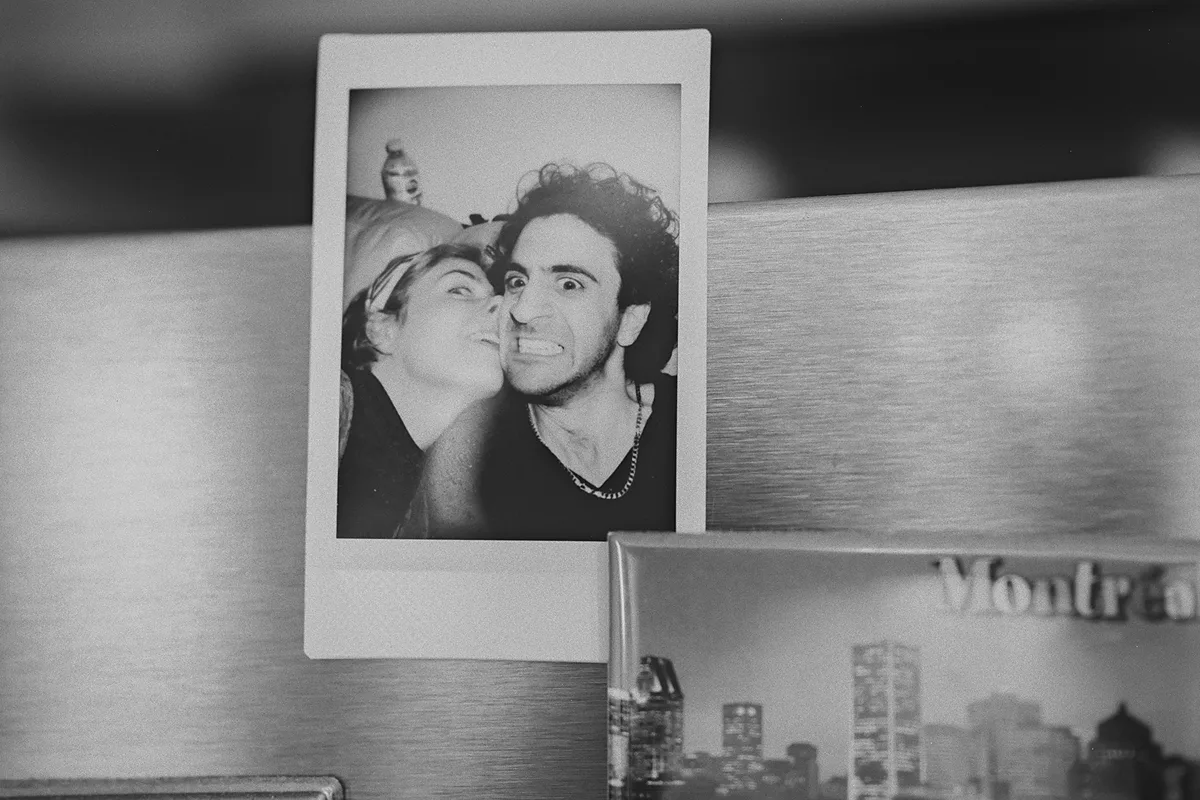 A polaroid of Beth and Mike on the refrigerator