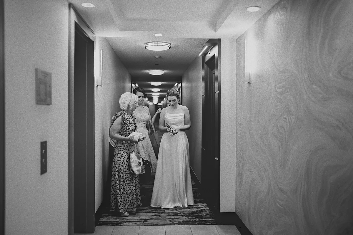 Beth and her family wait for the elevator