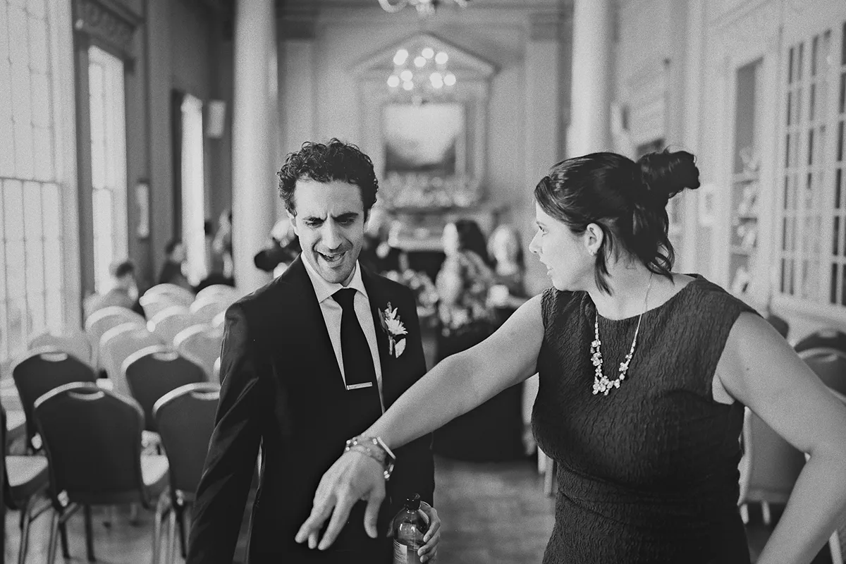 Mike laughs with a guest before the ceremony starts