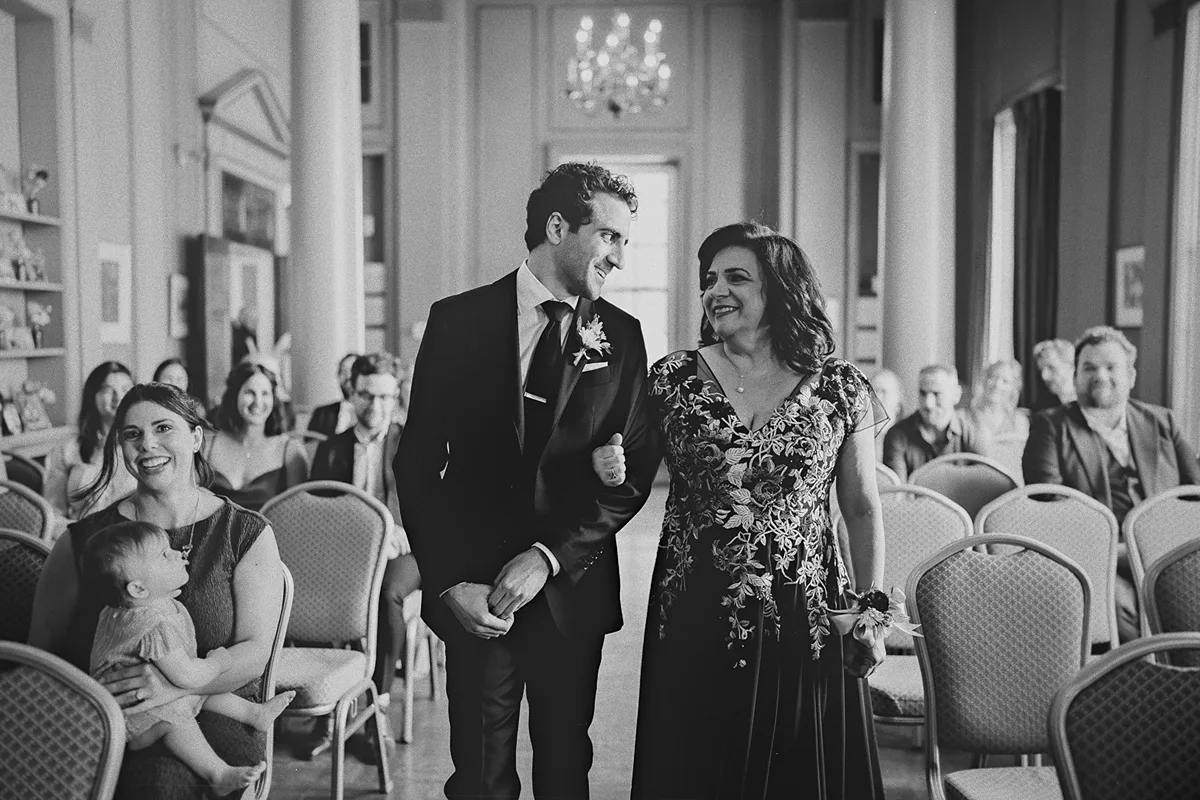 A heartfelt moment between Mike and his mother during the processional