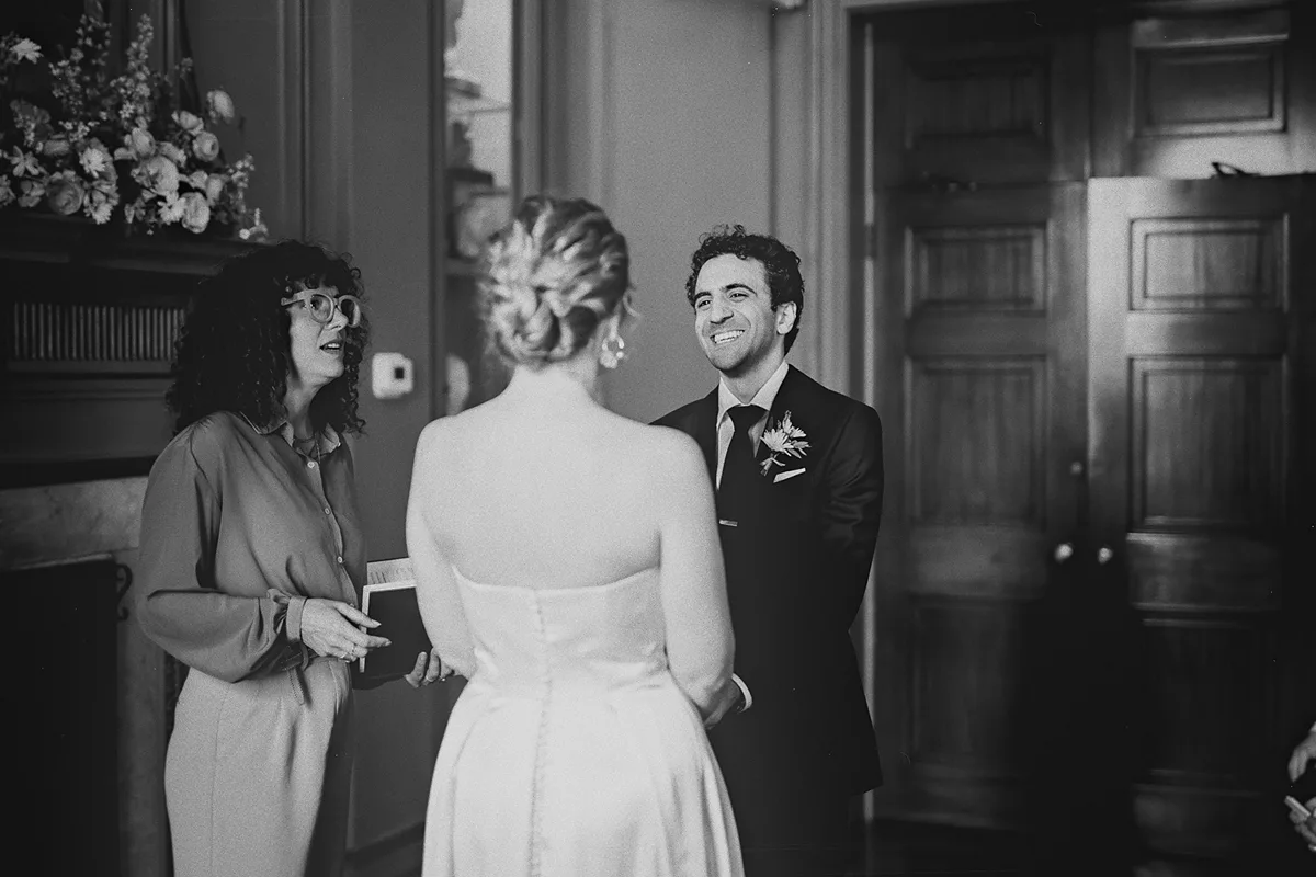 The couple and officiant during the wedding ceremony