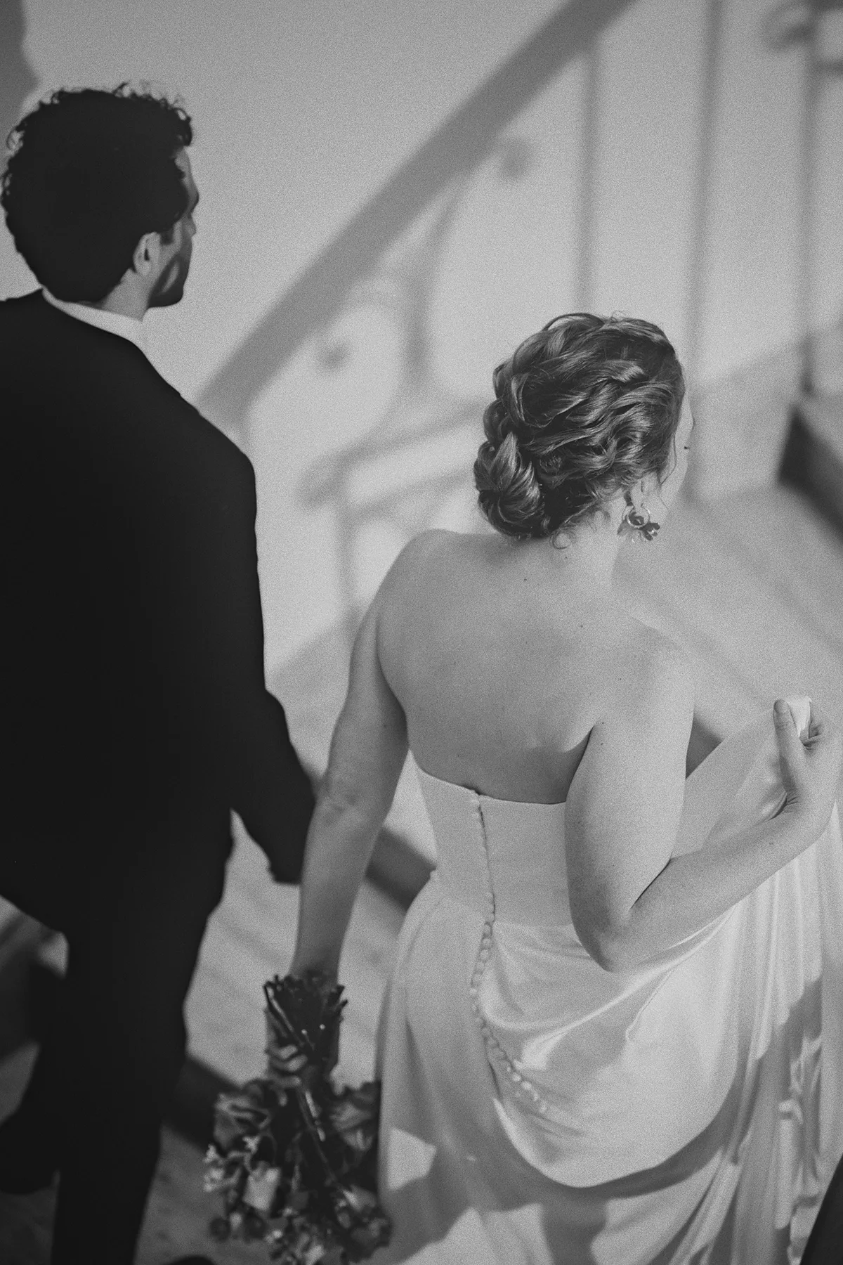 The couple walks up the stairs together