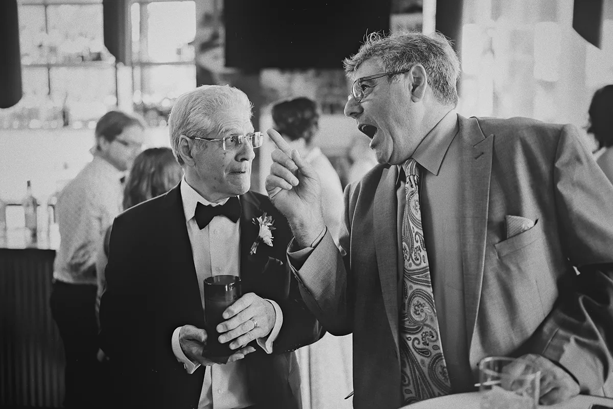 Guests enjoying a lively discussion at the reception