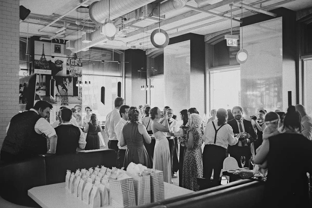 A wide view of the reception space filled with guests