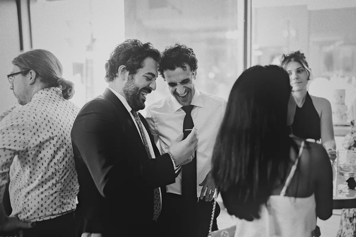 Mike shares a laugh with a friend at the reception