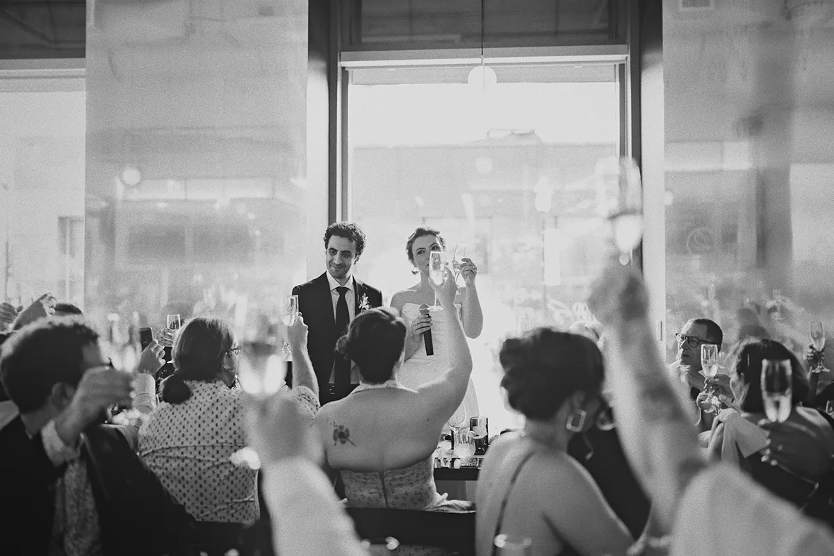 Guests raise their glasses for a toast