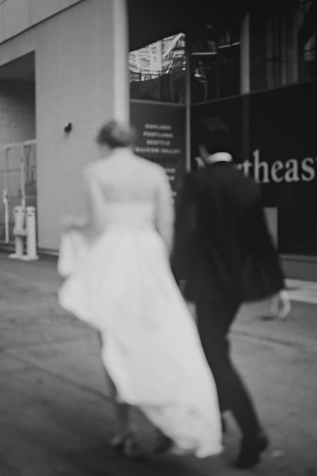 A blurry photo of the couple walking away