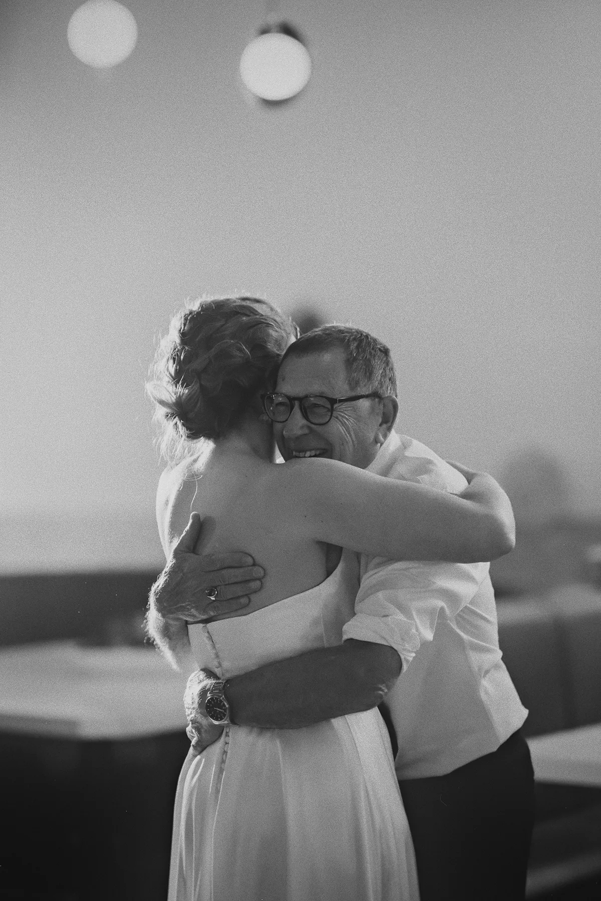 A heartfelt hug between the bride and her father