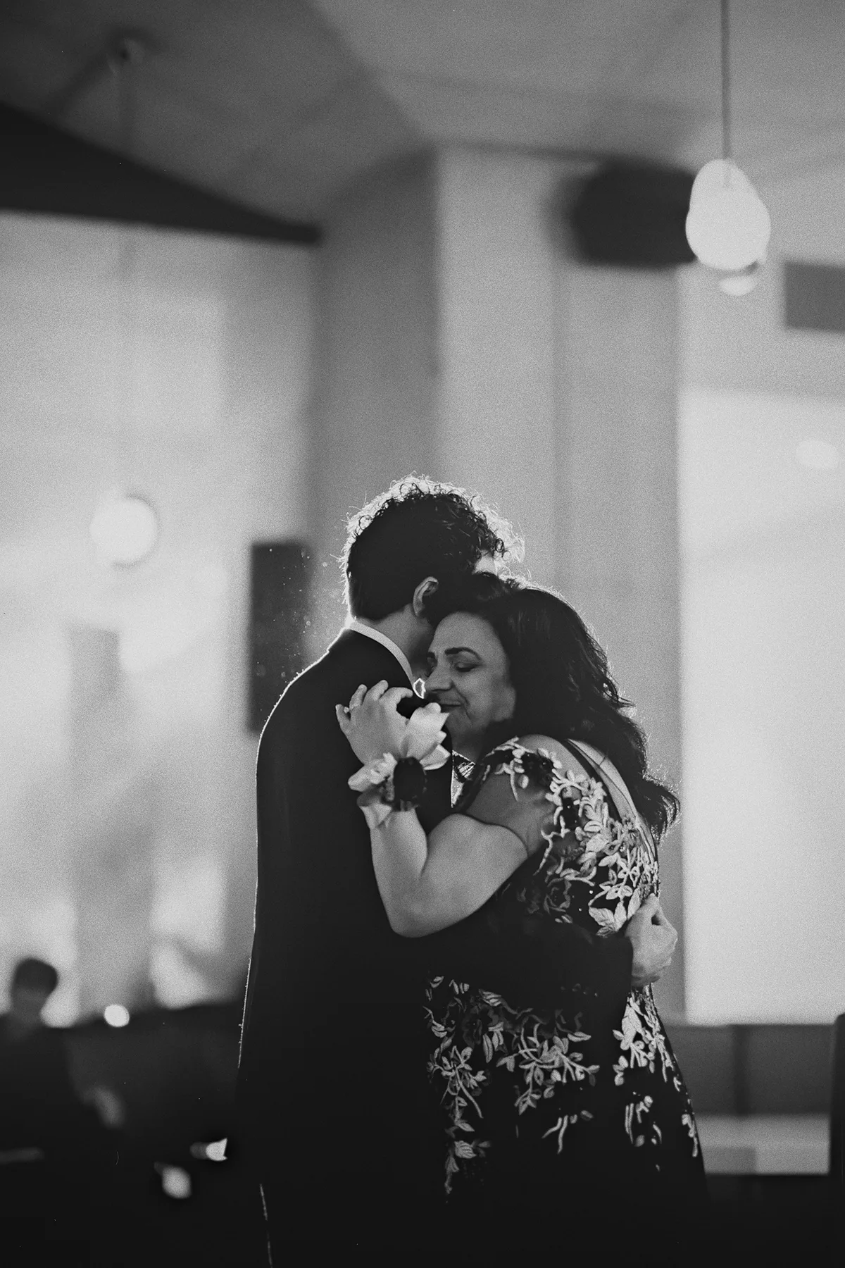 An emotional hug during the mother-son dance