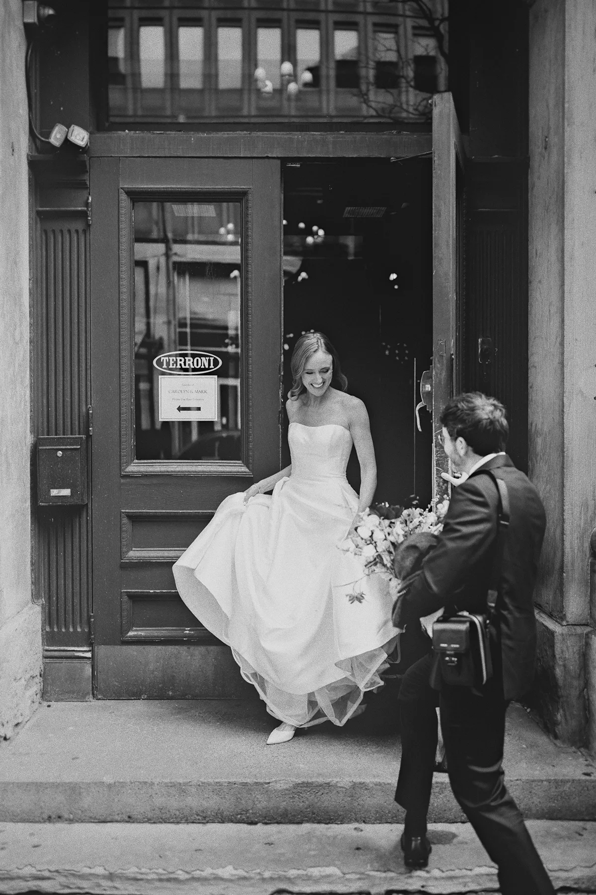 Carolyn exits the venue with help from her groom