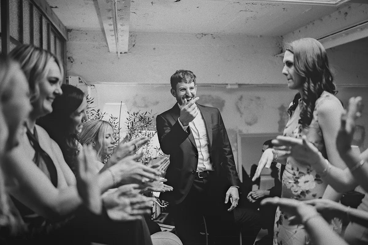 Mark dances playfully with the bridesmaids