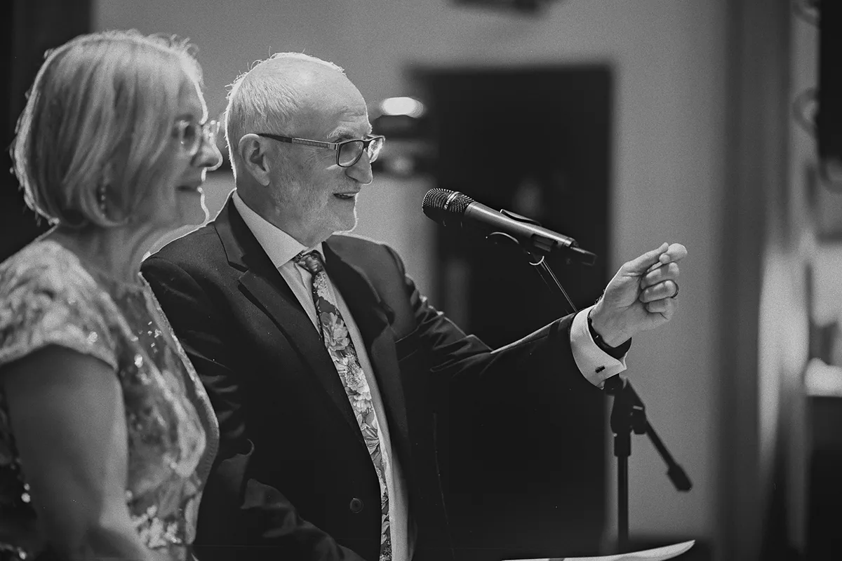 A father proposes a toast to the happy couple