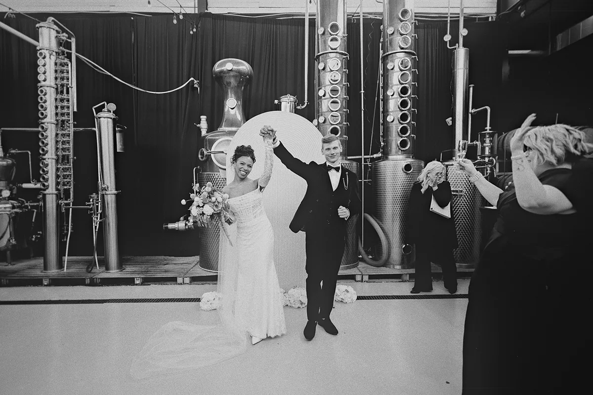 The couple celebrates as they walk back down the aisle.