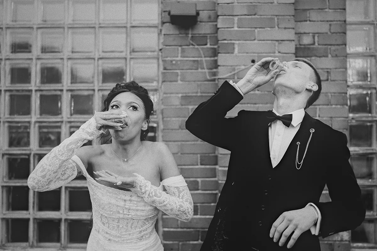 The couple takes shots together during a cultural tradition.