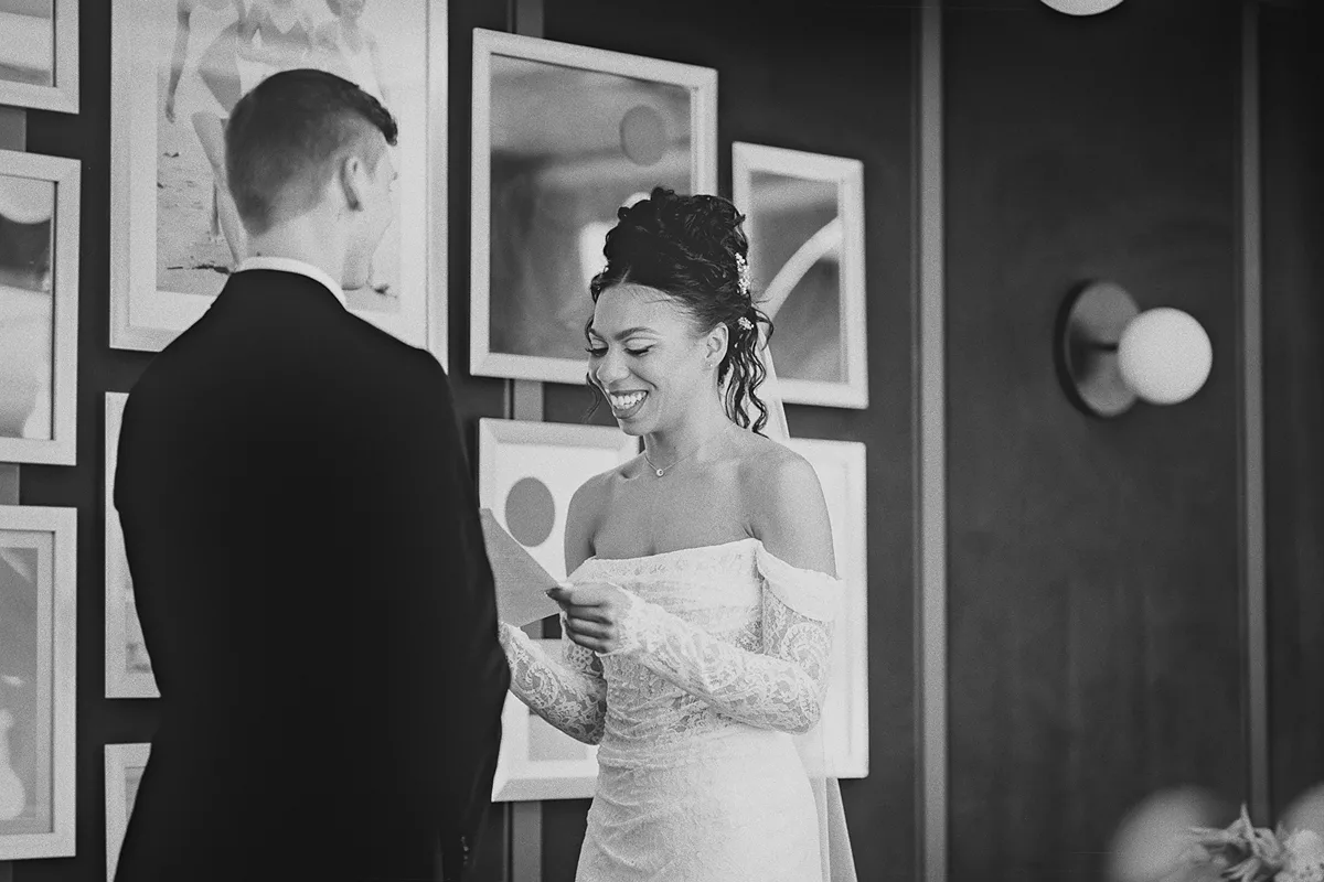 Cherise smiles while reading her vows to Konrad