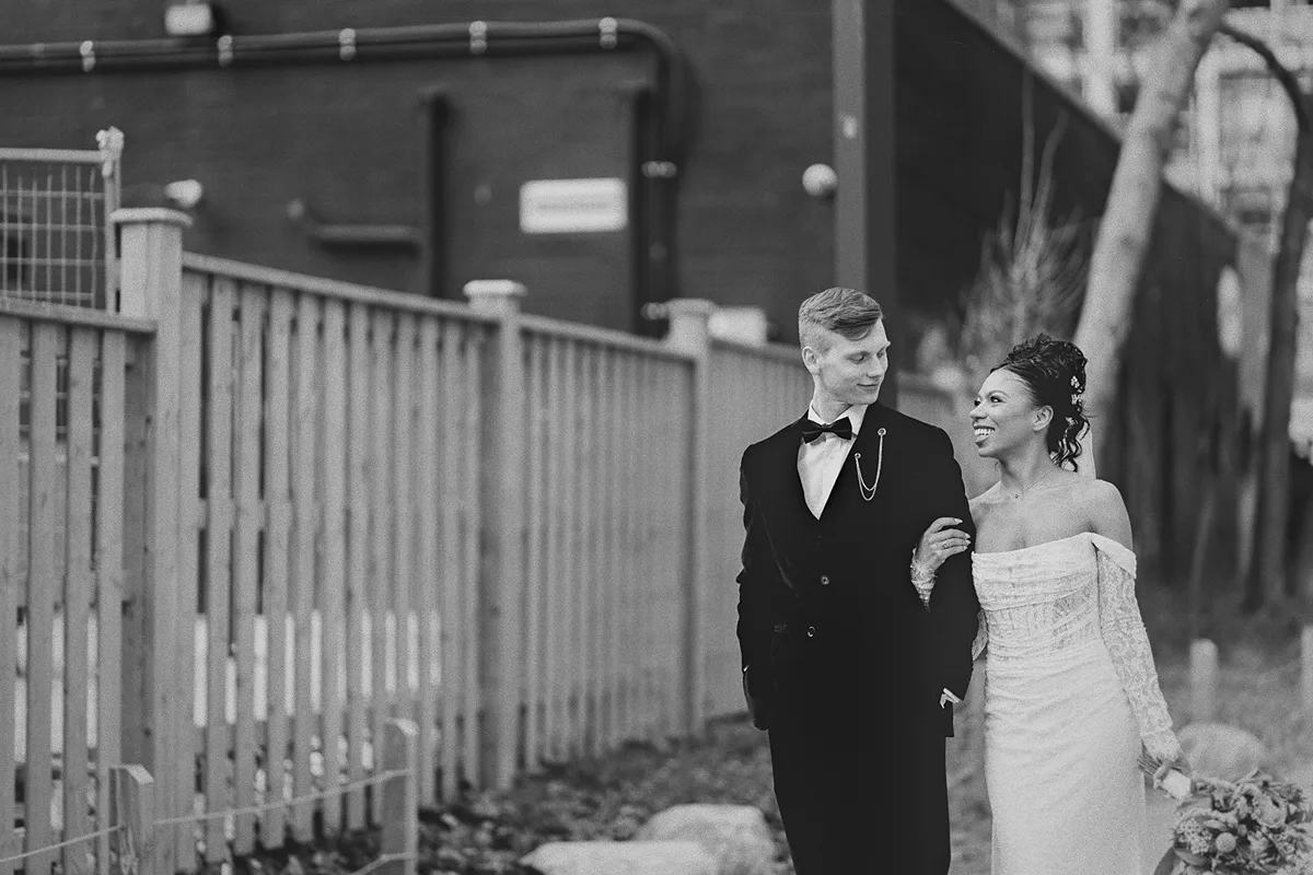Konrad and Cherise walk together on their wedding day