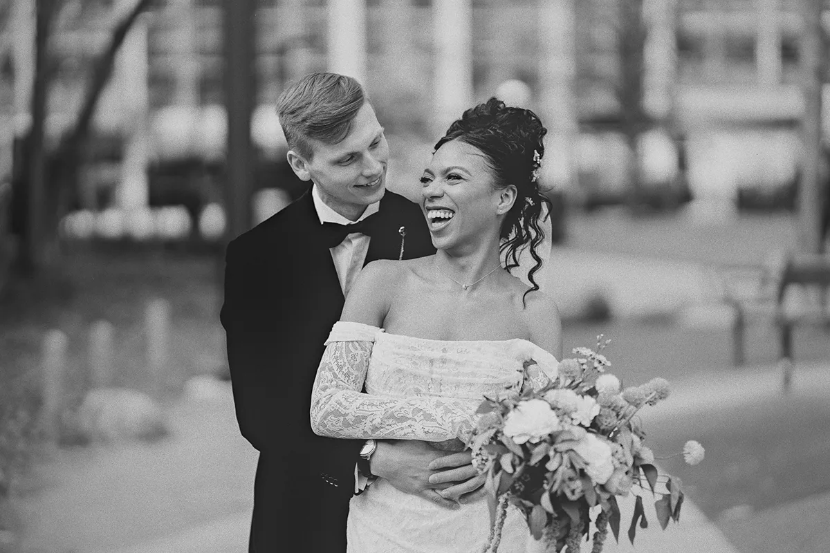 A joyful moment as the groom hugs the bride