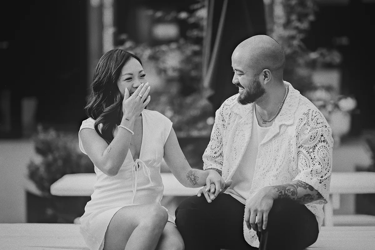 Jamie makes his fianc�e Corrina laugh during their engagement session.
