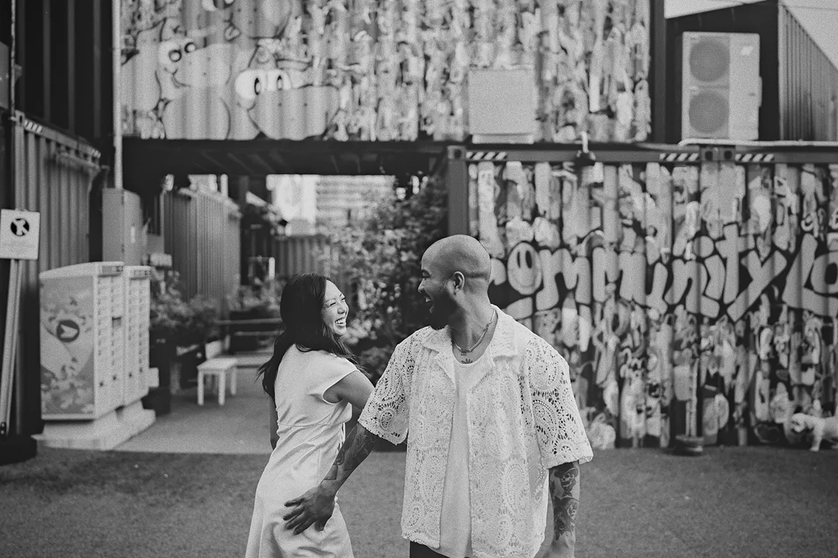 A playful moment as the couple dances together.