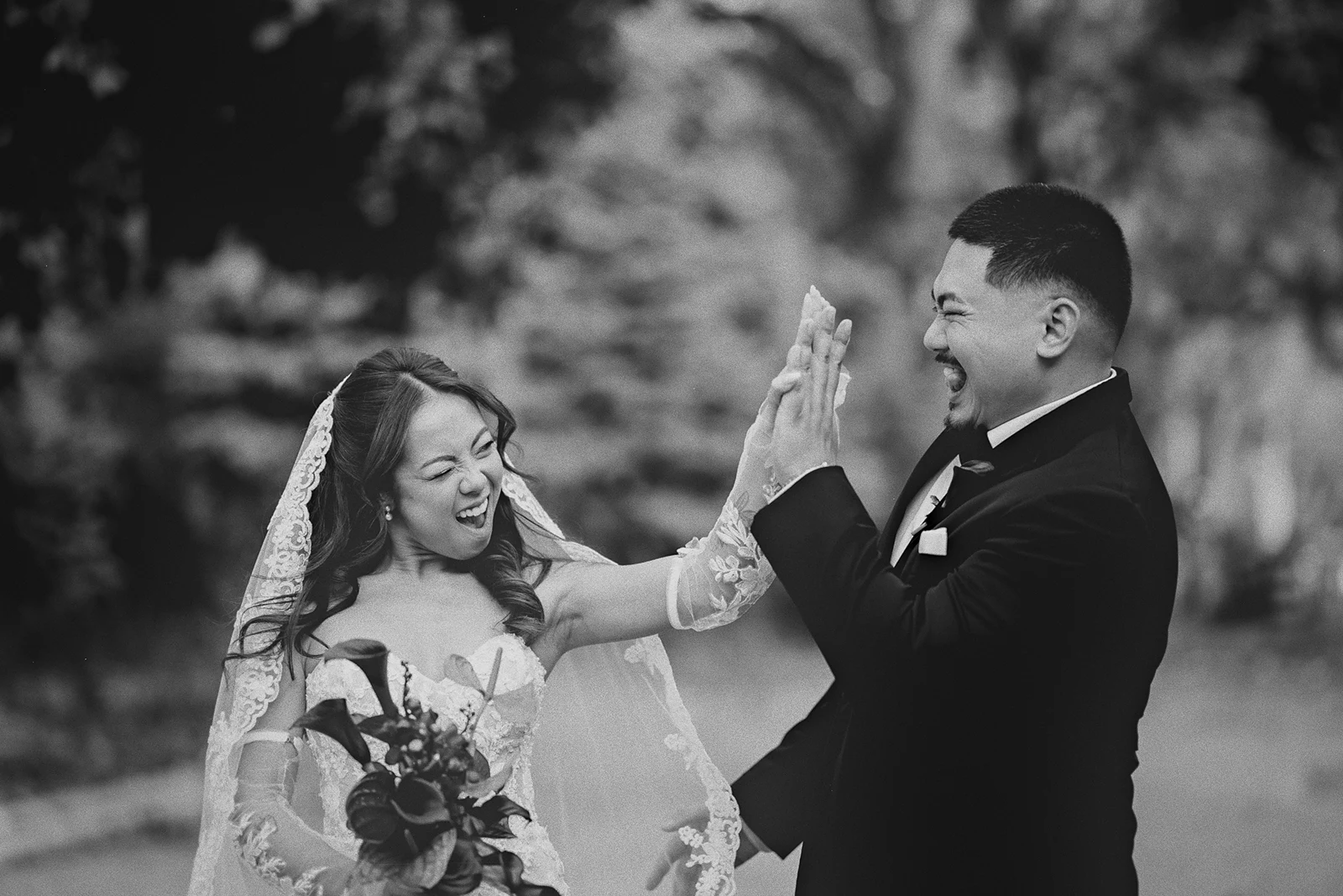Corrina and a family member share a playful high-five