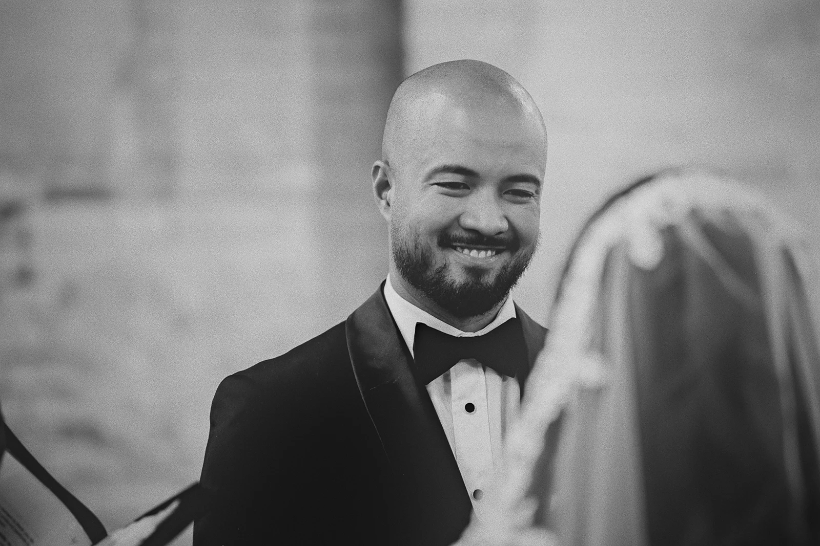 Jamie smiles warmly at Corrina during their vows