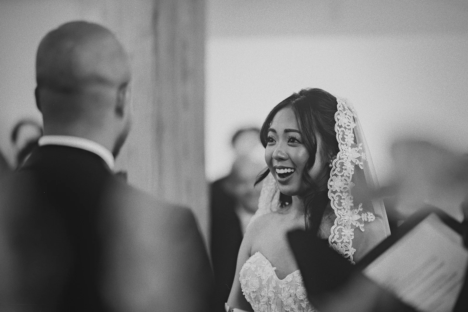 Corrina laughs while saying her vows to Jamie