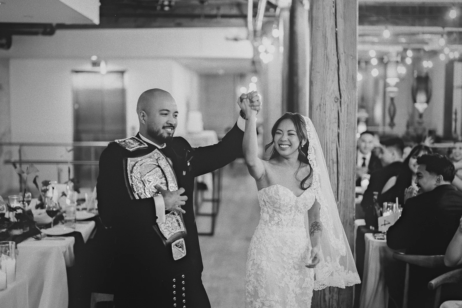 The couple celebrates as they enter their reception