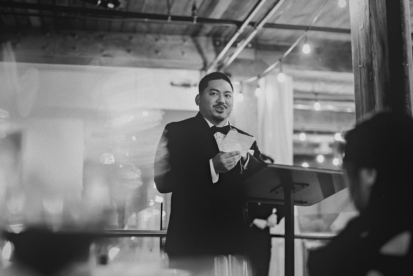 A groomsman gives his speech at the reception