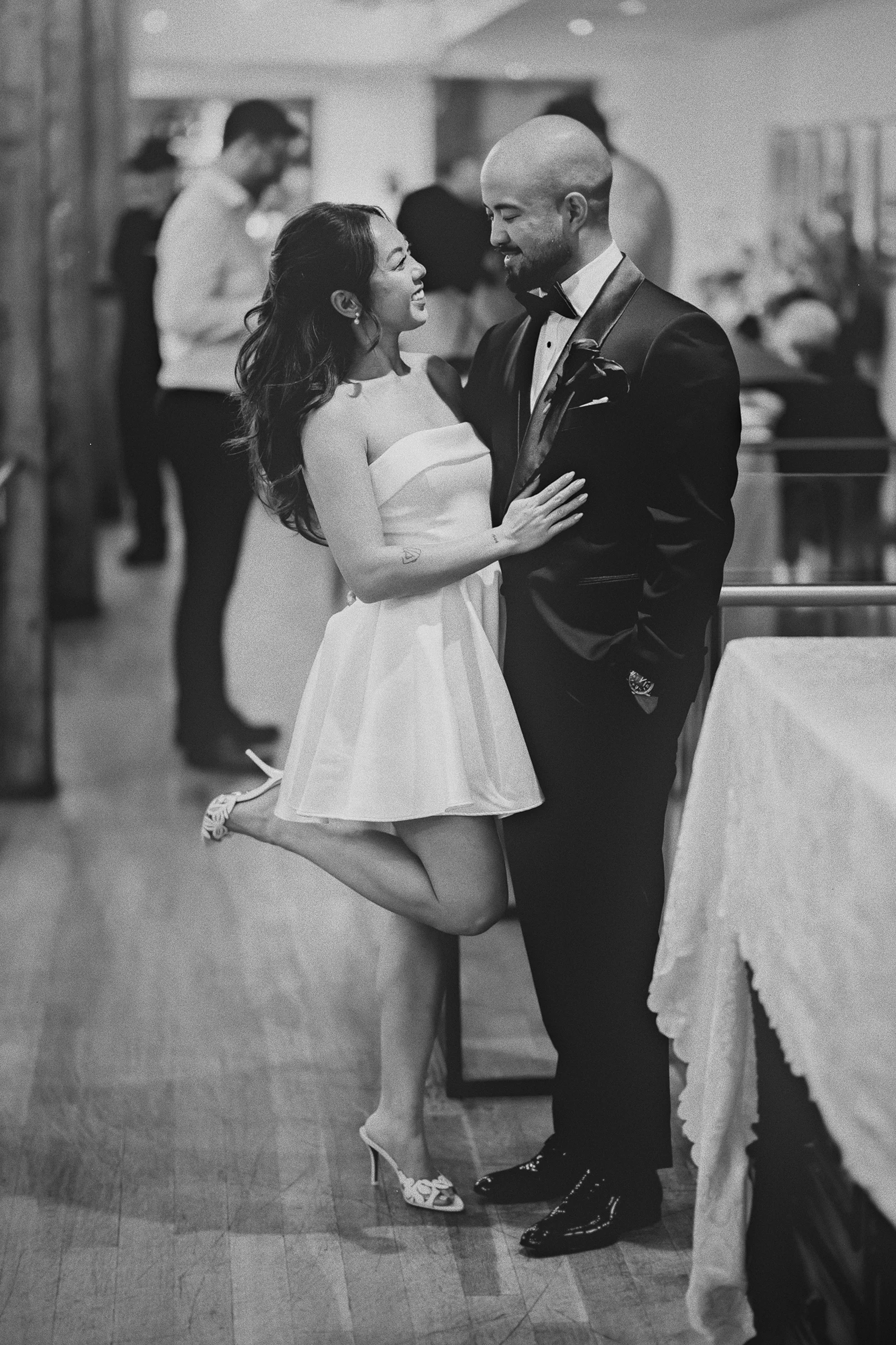Corrina, in her second dress, poses with her husband Jamie