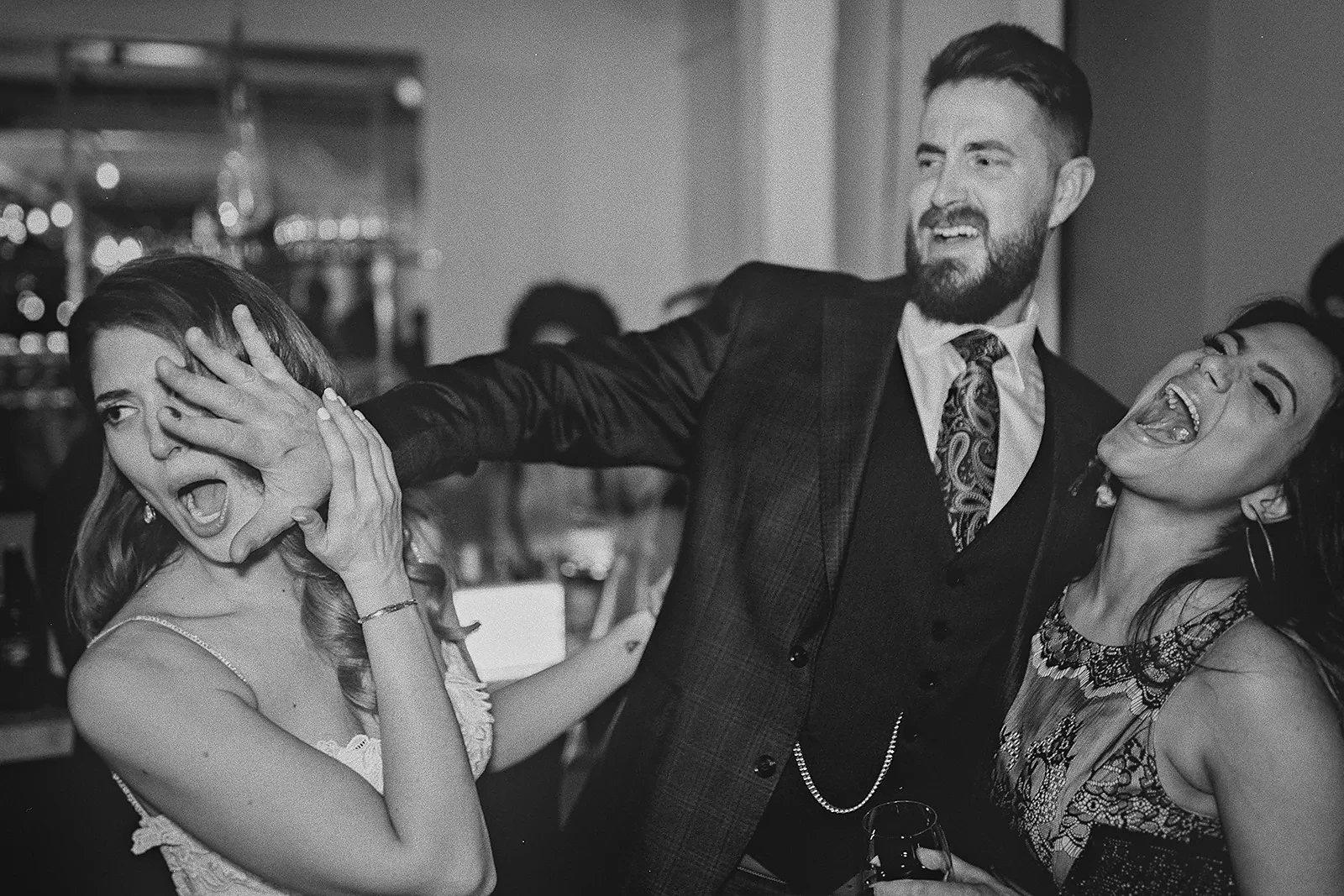 Daniela and Ryan in a funny, candid photo with a friend.