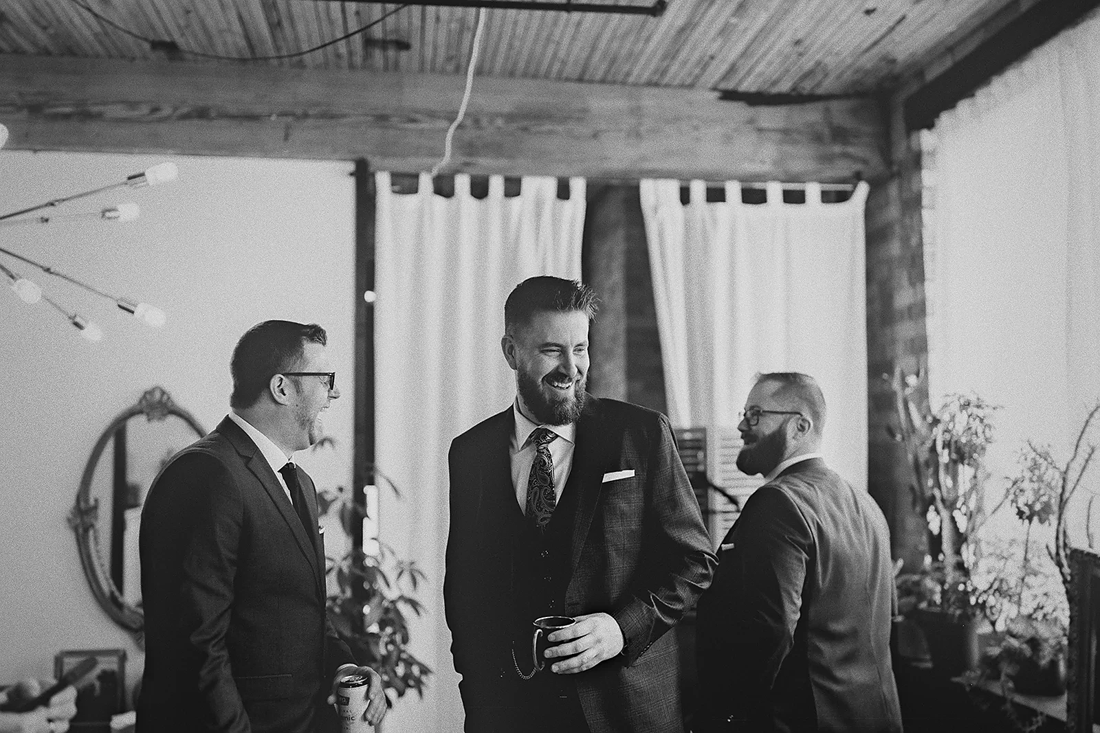 Ryan laughs with his groomsmen before the ceremony