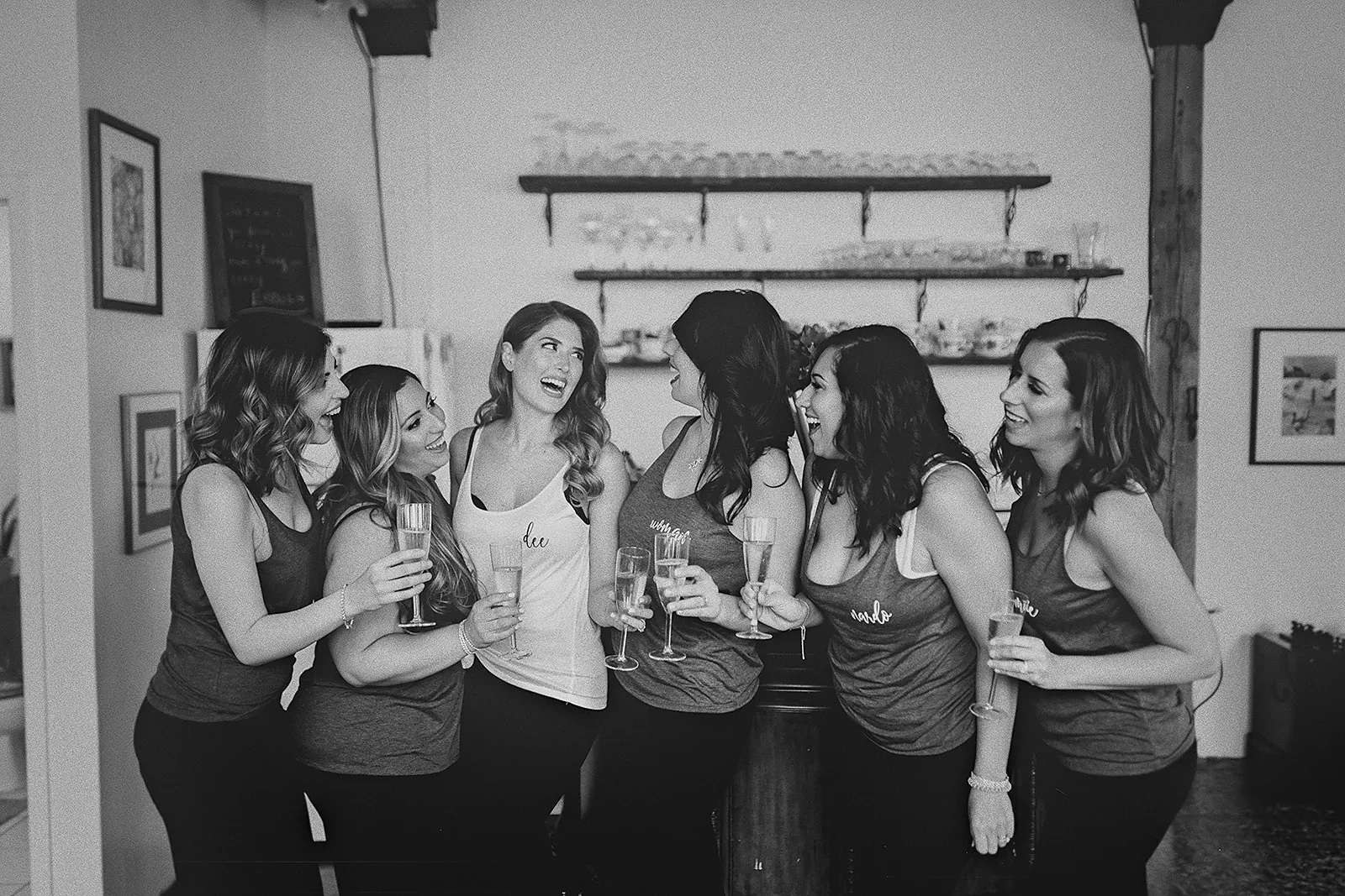 Daniela and her bridesmaids laugh together