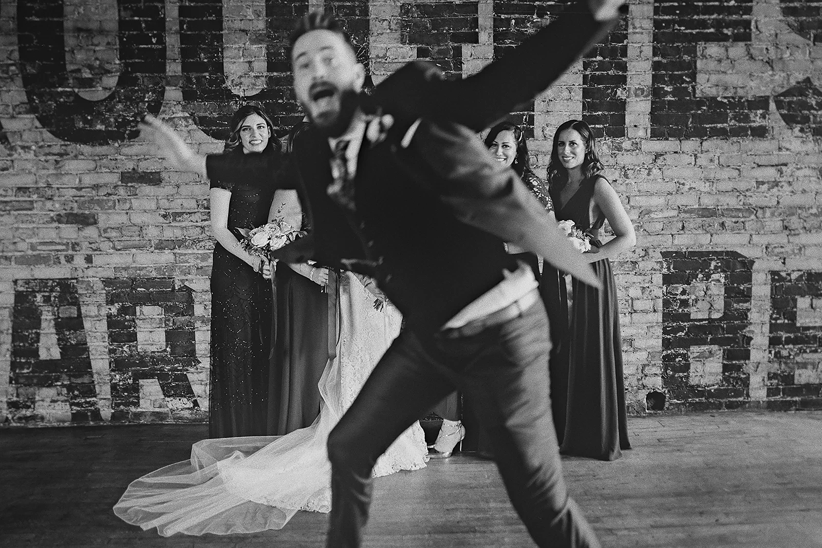 Ryan playfully photobombs the bridesmaids' portrait