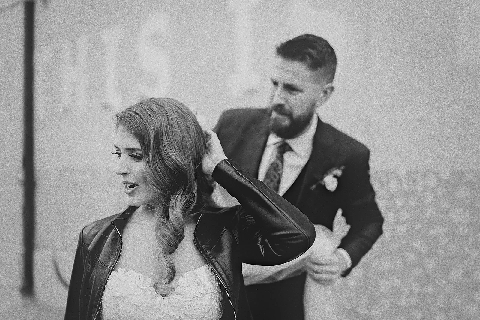 Daniela reacts as Ryan adjusts her veil