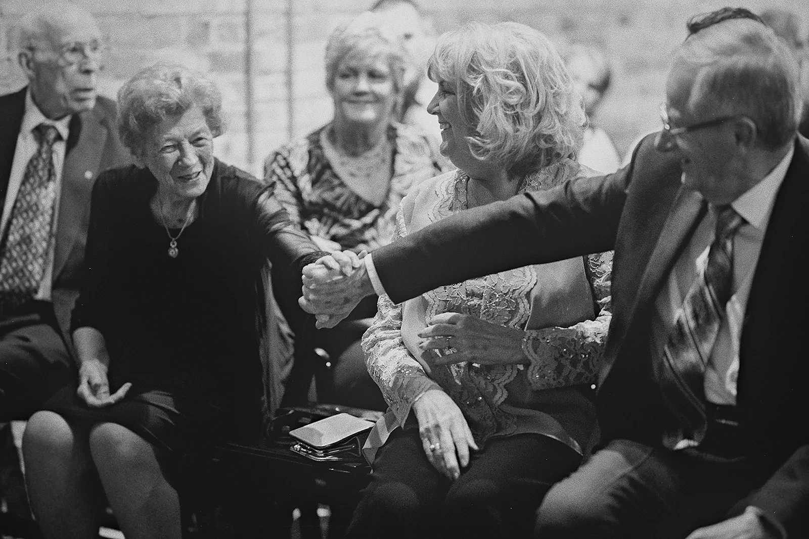Family members greet each other before the ceremony