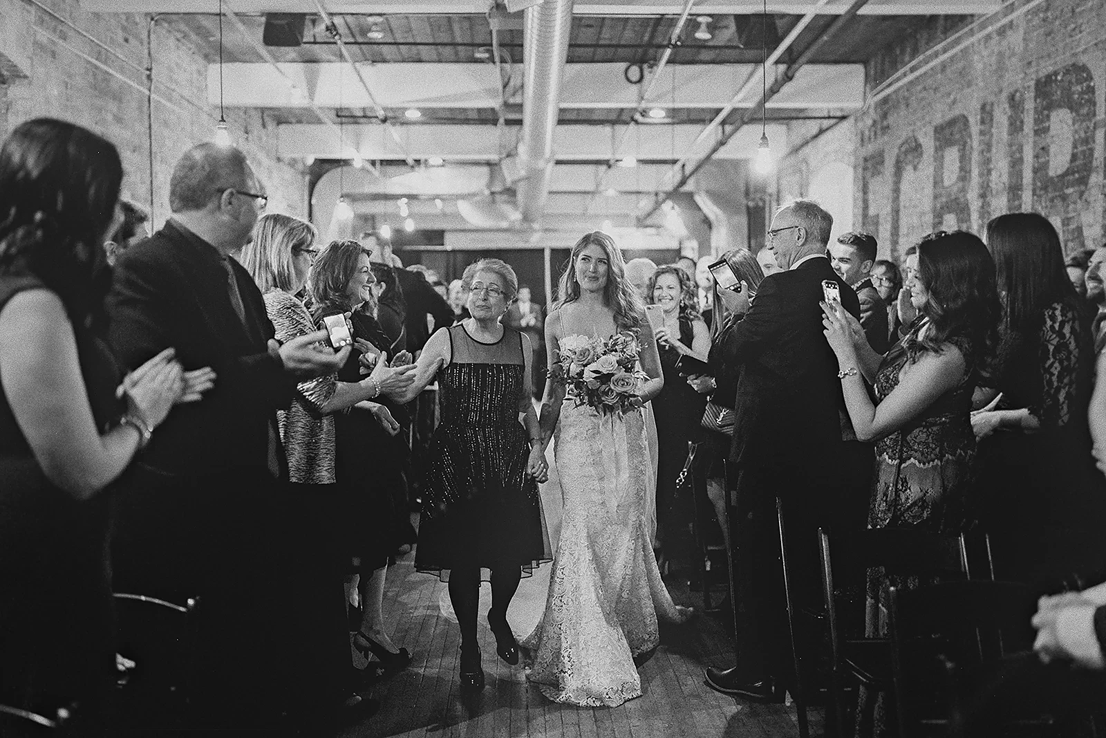 The bride walks down the aisle with her mother