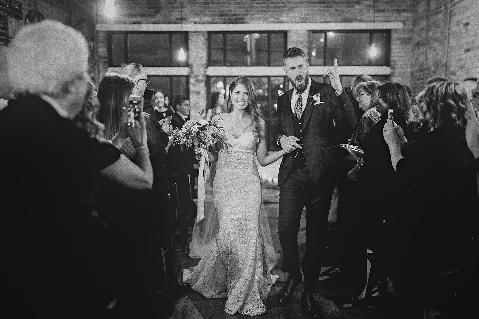 Ryan celebrates as he and Daniela exit the ceremony
