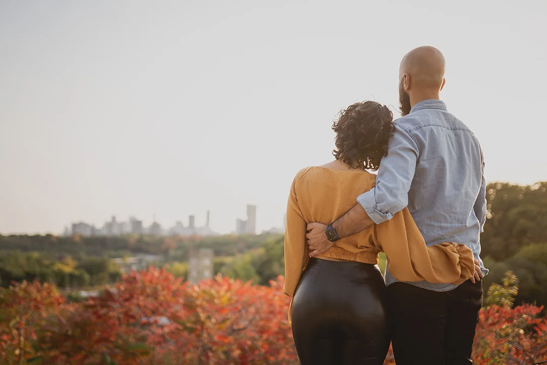 Bride and Groom to be looking over Toronto from the Brickworks