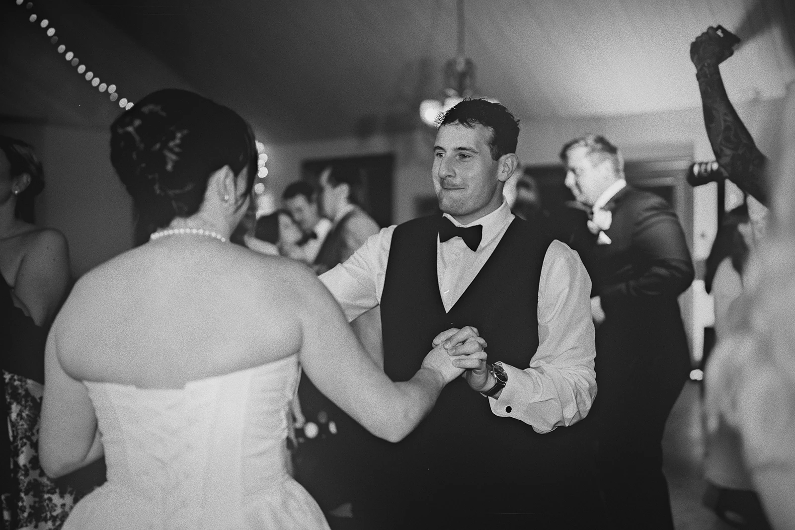 Kieran smiles at Hillary as they dance.