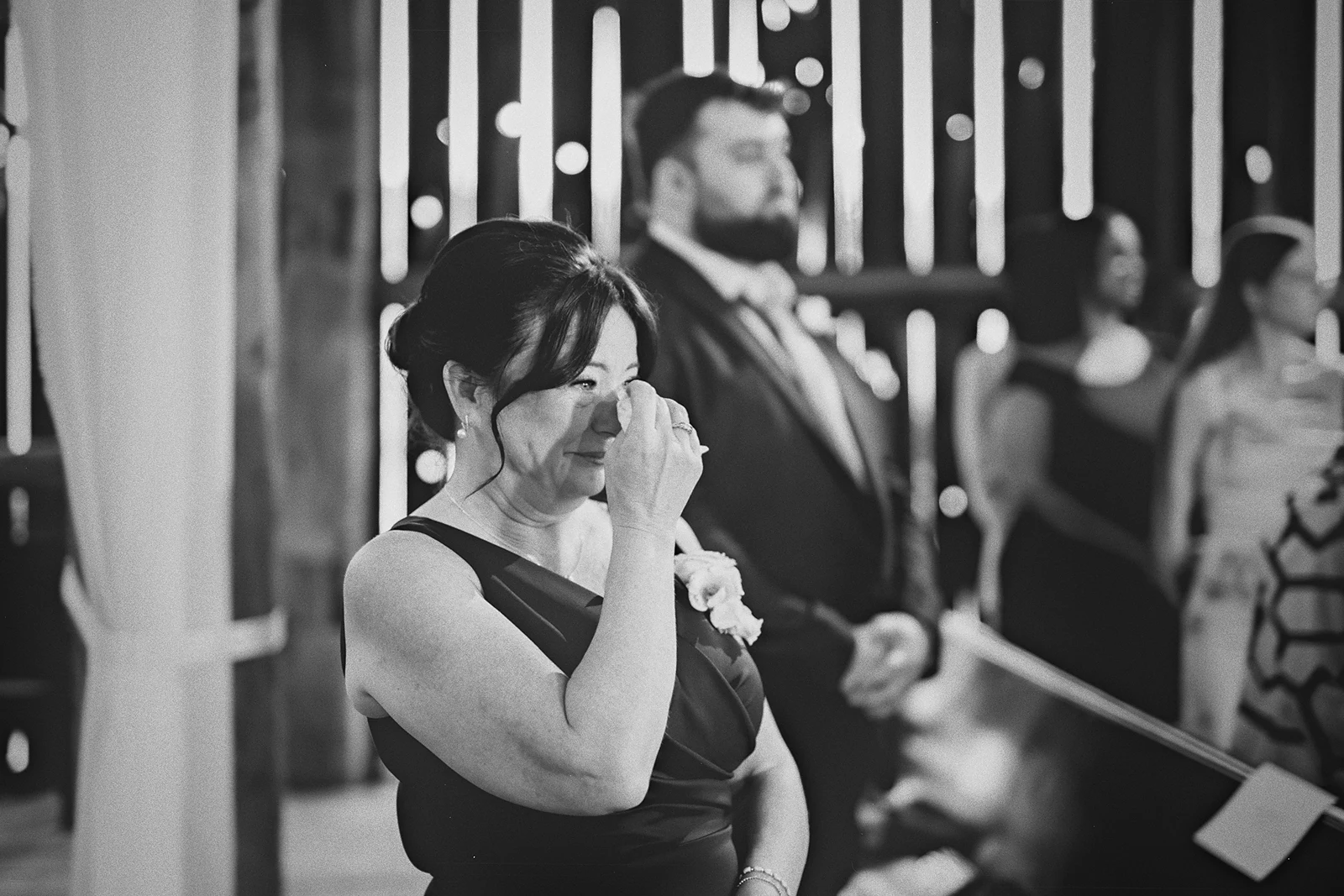 A mother wipes away a tear during the ceremony.