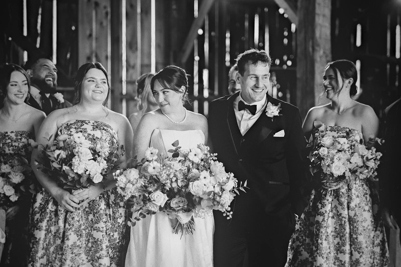 Hillary and Kieran share a laugh with the bridesmaids.