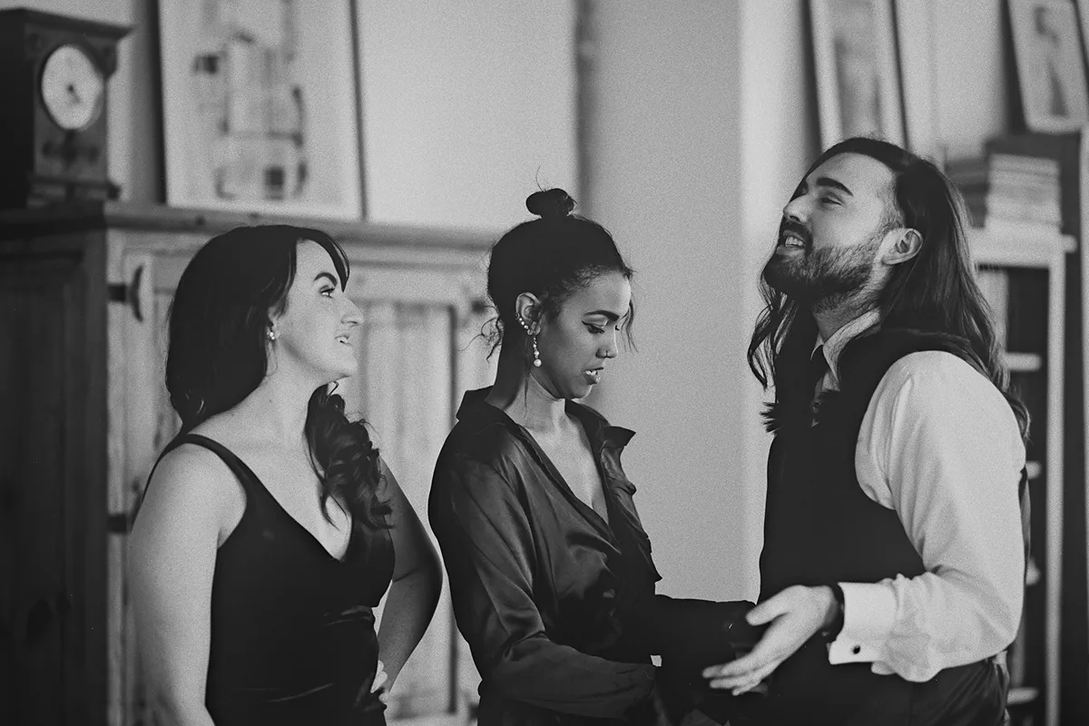 The wedding party shares a candid moment together
