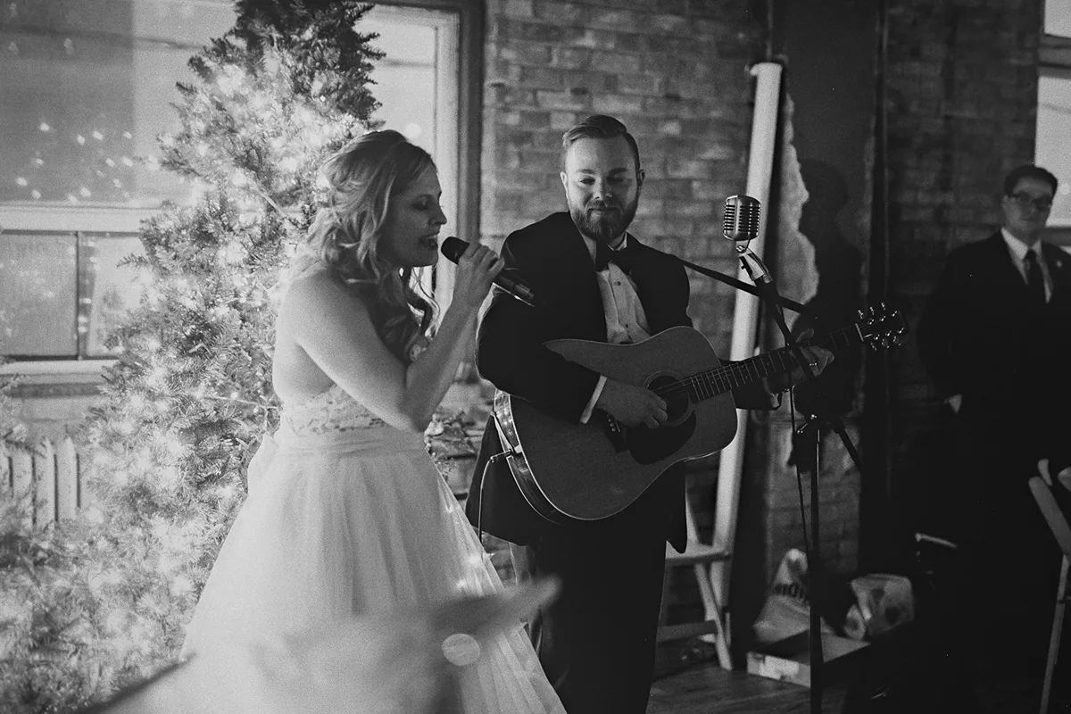 Jessi sings while Alex plays guitar.